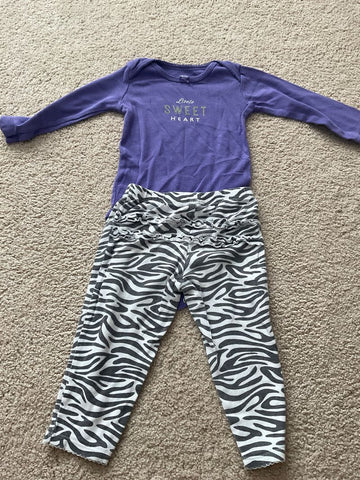 Carters Long sleeve onesie with ruffle butt pants. Pants slightly faded 12 Months