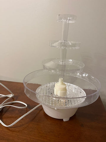 ? Lighted fountain.Used under tiered wedding cake. Some scratches Decor