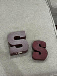 Hobby Lobby The large S is wooden and heavy. The smaller is tin Decor