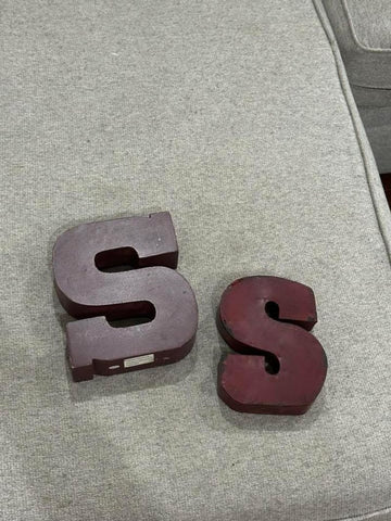 Hobby Lobby The large S is wooden and heavy. The smaller is tin Decor