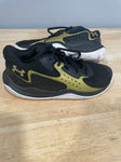 Under Armor Black and Gold tennis shoes 3 (Big Kid)