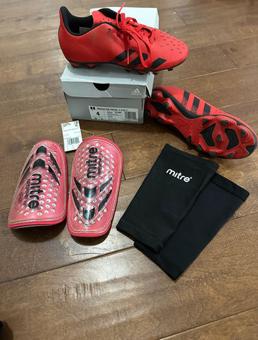 Adidas Soccer cleats Worn once. Shinguards & sleeves. All practically brand new 4 (Big Kid)