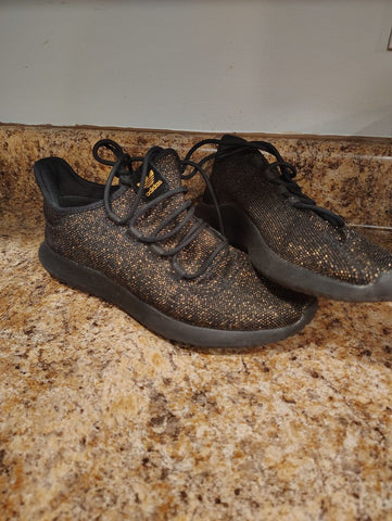 Adidas Black and gold shimmer shoes size 7 women's Adidas good condition 7 (Adult)