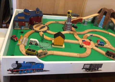 Train Set Train set with tracks and pieces. Also a great game table Building